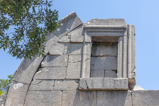 The ruins of Termessos. An ancient megalithic structure in Turkey. Ancient buildings of previous civilizations. Arches made of megalithic stone blocks.