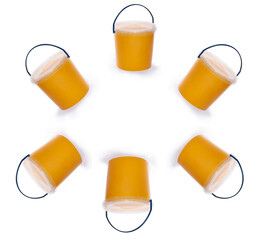 Full transparent bucket with bee honey on a white background © i_valentin