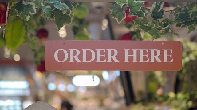 Order sign in busy cafe during afternoon rush