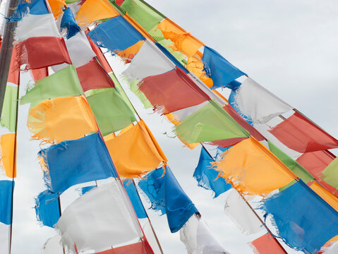 Colorful prayer flags fluttering in wind on Inner Mongolia grassland