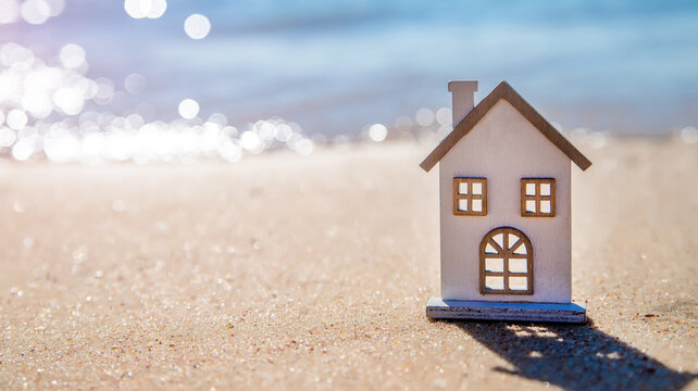 The symbol of the house standing on the seashore