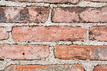 Obraz premium Pared de ladrillo antiguo, fondo de textura rústica y envejecida