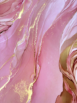 Abstract handmade not AI royalty free flud pink aquarelle or marble background with gold. Beautiful alcohol ink watercolor artwork. Backdrop texture or interior poster resembles natural pink stone.