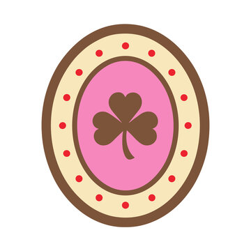 Shamrock cookie with pink and yellow icing