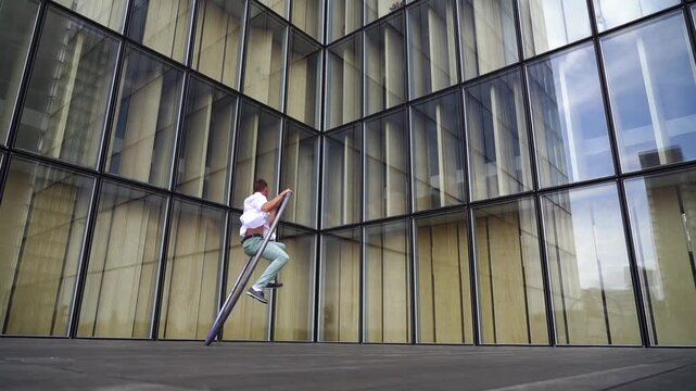 Dynamic and vibrant performance of a Cyr Wheel within urban architecture. Concept of originality, creativity and outstanding