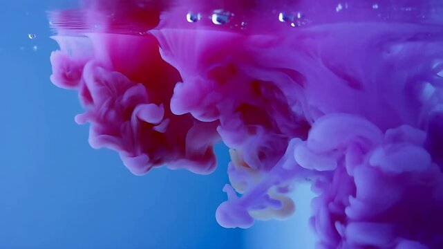 Colorful Ink Clouds Swirling Underwater in a Mesmerizing Looping Animation. Abstract Fluid Motion and Vibrant Color Transitions.