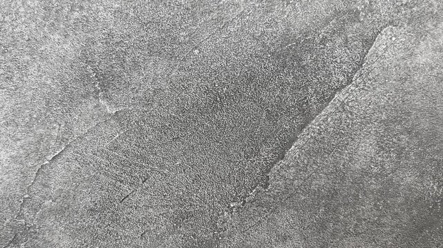 Gray concrete texture background with natural irregularities, copy space. Minimal monochromatic backdrop suitable for architecture, interior design, beauty and product presentation