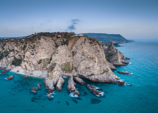 Rocky Capo Vaticano coast and turquoise sea from above