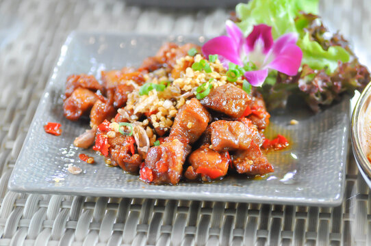 stir fried pork or deep fried pork , stir fried pork with garlic and chili