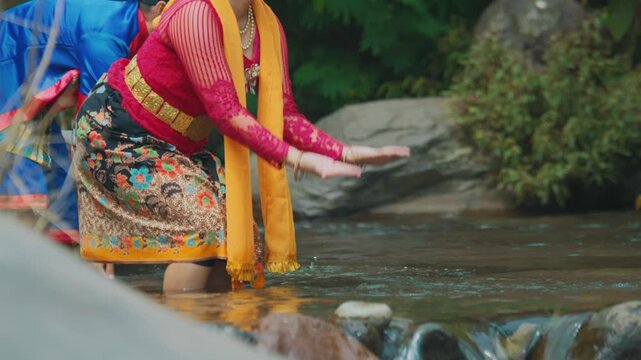 Traditional Female Dancer Splashing Water in River