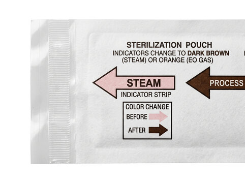 Medical sterilization pouch steam indicator strip detail showing autoclaving process instructions for clinical hygiene, dental tool sanitization, infection control, and laboratory safety compliance.