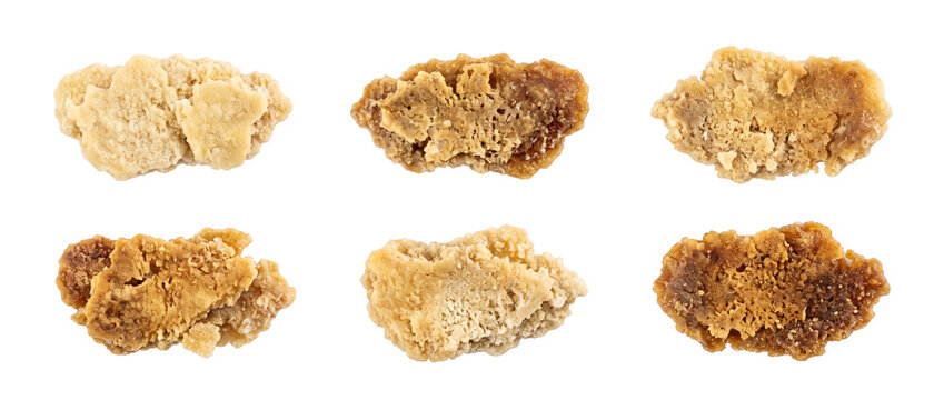 Cannabis concentrate wax crumble dabs set isolated on black background, macro view of golden THC CBD resin extract chunks for medical marijuana, legal weed product photography collection.