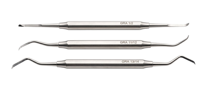 Dental curette instruments stainless steel medical dental tools set isolated on black background for dentistry, oral hygiene, periodontal treatment, and clinical practice photography.