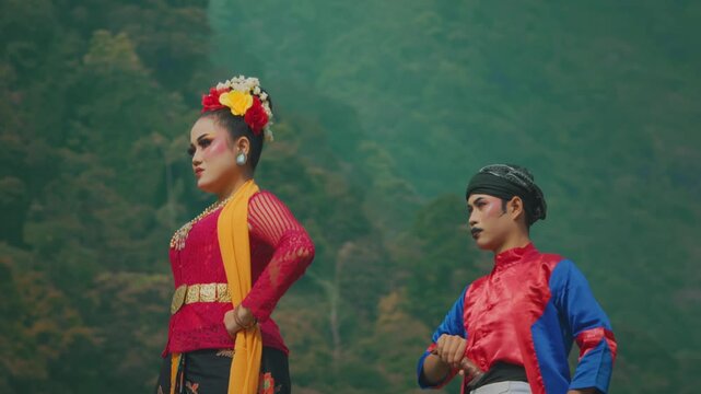 Low Angle of Traditional Indonesian Martial Arts Couple Posing