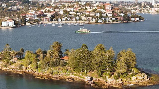 Aerial drone view of Shark Island on Sydney Harbour in East Sydney, NSW, Australia with Point Piper in the background on a sunny morning in August 2026