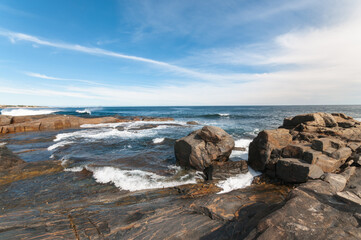 Rugged coastline at Gracetown, Western Australia, with breaking Indian Ocean waves, weathered rock formations and coastal houses overlooking the bay in the Margaret River region. © Anna Zaro