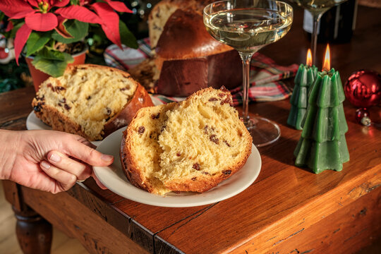 Festive Panettone on Wooden Table With Candles, Poinsettia and Wine Glass for Christmas Morning