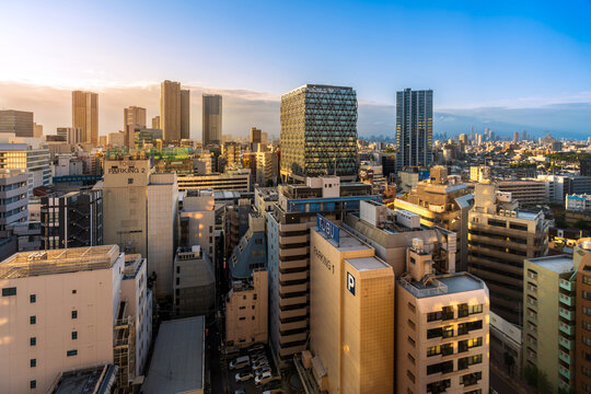 Modern city skyline and skyscrapers at sunrise in Toshima, Ikebukuro, Tokyo, Japan