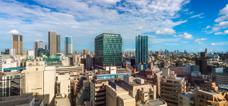 Modern city skyline and skyscrapers on sunny summer day in Toshima, Ikebukuro, Tokyo, Japan