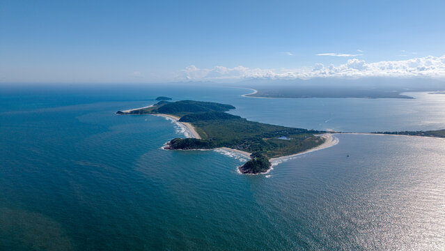 Aerial view of Ilha do Mel surrounded by turquoise waters, sandy beaches, and lush green vegetation in Paranagua, Parana, Brazil.
