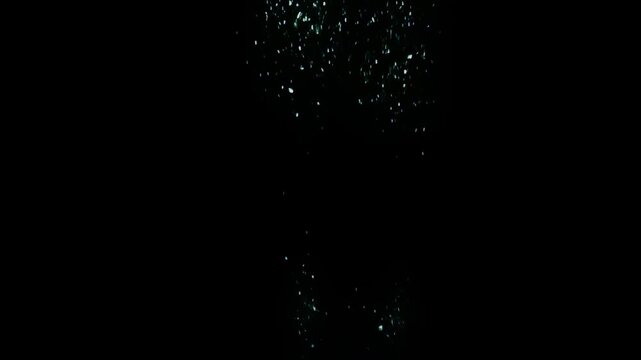 Sparse Underwater Bubble Trail On Black Background