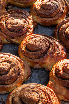 Cinnamon rolls, delicious traditional yeast pastry with addition cinnamon, brown sugar and butter, close-up
