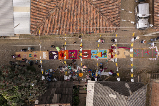 Aerial view of the Patamban floral rug being created by local people on a cobblestone street in Patamban, Michoacan, Mexico.