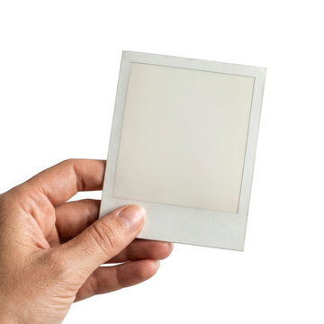 A hand holding a blank white square photo frame isolated