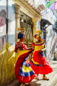 Palenqueras dancing in traditional dresses, Cartagena, Colombia