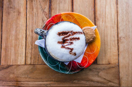 Cappuccino served on a colorful plate, Bogota, Colombia