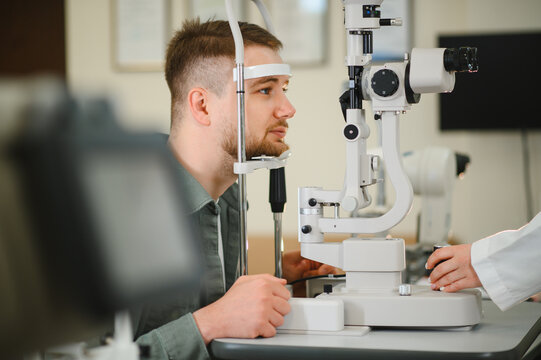 Man undergoing eye examination with slit lamp