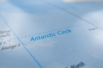 Naklejka premium Map of Antarctic Circle styled in grey color. Selective focus on label, close-up view