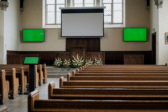 Empty Church Interior with Green Screen Monitors and Projection Screen