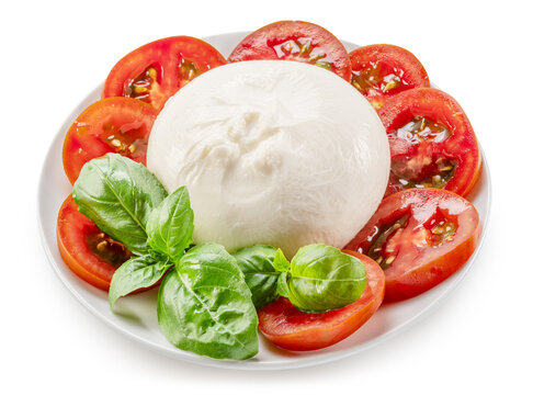 Top view of burrata cheese (or buffalo mozzarella) with cherry tomatoes and basil on plate isolated on white.