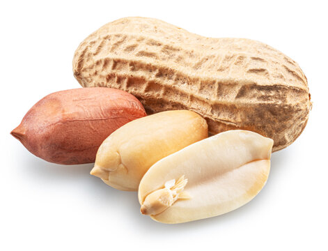 Group of whole and cracked peanuts isolated on a white background.