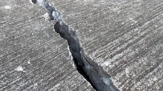 Deep Structural Concrete Gap and Ruined Road Fracture