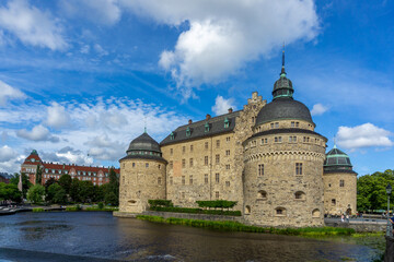 Fototapeta premium Romanesque Örebro Castle in Sweden standing over Svartån river