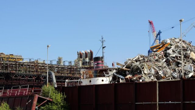 Dismantled rusted ship in a scrapyard for recycling