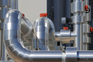 Obraz premium Data centre cooling water pipe bends and valves in insulated mechanical pipework