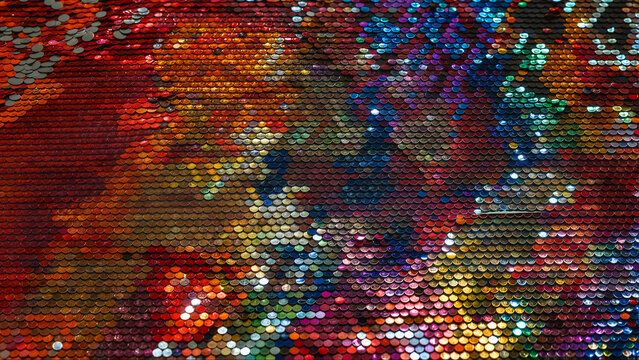 Close-up of a colorful sequin fabric with iridescent shimmer