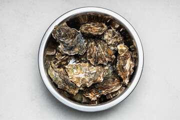 Overhead Bowl Of Closed Oysters With Texture © Belashova