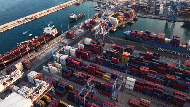 MFT Birzebbugia, Malta - August 10, 2026:  Malta Freeport with container terminal and adjacent oil terminal, orbit drone footage.