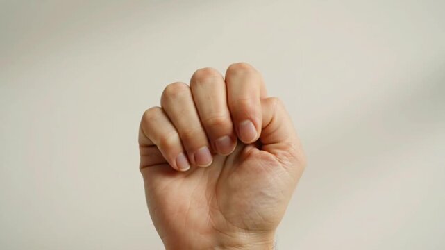 a human hand making a distinctive gesture, suitable for communication, symbolism, body language, expression, and social interaction concepts.