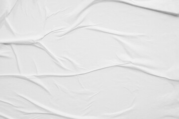 white crumpled and creased glued wrinkled paper poster texture background