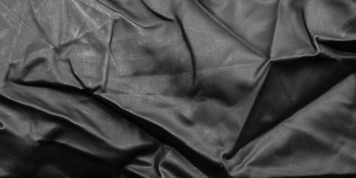 Abstract Black Rubber Latex Texture Background with Elegant Folds and Shadows