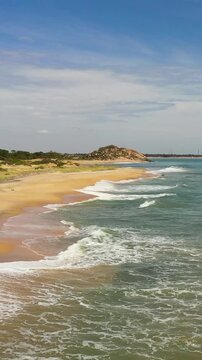 Seascape with tropical sandy beach and blue ocean. Sri Lanka.