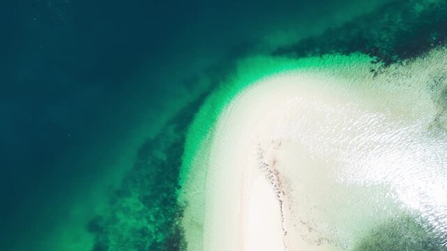 Aerial drone view Gili Kere Sand Tongue Lombok Indonesia on sunny day with white sandbar turquoise lagoon and tropical seascape