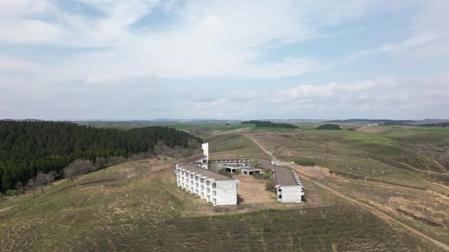 Aerial Drone View of Abandoned Himiko no Sato Resort Hotel in the Aso Grasslands, Kumamoto Japan