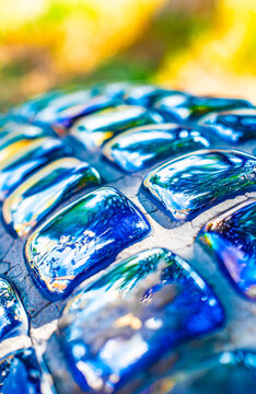 Close up of blue ceramic mosaic tile decoration with geometric diamond pattern