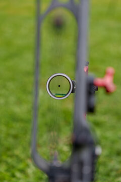 Green bow archery scope crosshair macro detail shot 1.